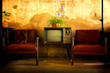 Vintage television, Antique TV, Retro technology, Old TV and old red sofa in room