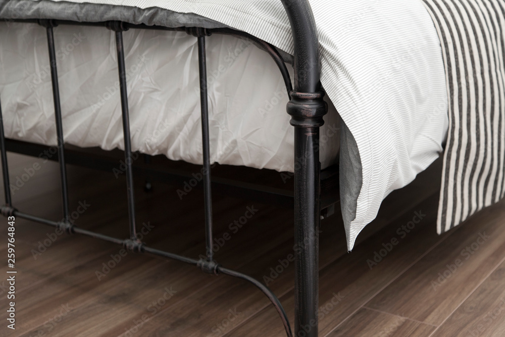 Obraz na płótnie close up of bedding iron frame with white comfortable blanket and mattress w salonie