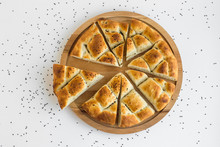 Triangle Sliced Ramadan Bread,pide On The Round Wooden Tray With Nigella Seeds.