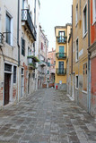 Fototapeta Uliczki - Narrow old street in Venice Italy