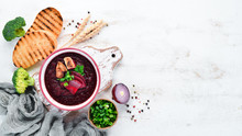 Beetroot Cream Soup In A Bowl, With Toast Bread. Dietary Food. Top View. Free Copy Space.