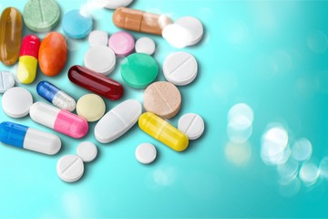 Sticker - Colorful pills and tablets on background