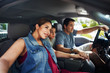 © Joshua Resnick - hispanic family with mother, father and son sitting in truck looking outside