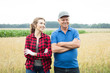 © Snapic.PhotoProduct - Happy two farmers standing against wheat field