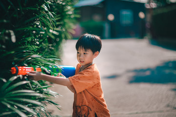 Children playing  Water gun  in Water Festival  Chiang mai Thailand