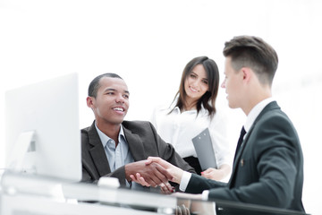 Wall Mural - handshake of business partners sitting at a table Desk