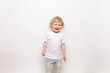 © yana136 - child playing with toy airplane against on a white background. concept dreams of flight