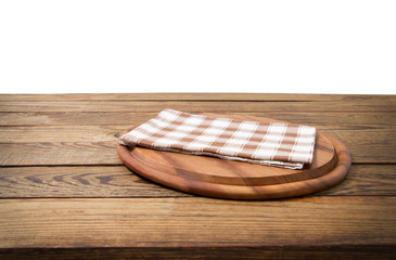 Wall Mural - Brown old vintage wooden table with framed checkered tablecloth and pizza cutting board isolated on white background. Thanksgiving day. Cristmas table concept. Top view and copy space. Selective focus