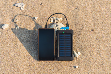 Wall Mural - Portable solar panel is on the beach