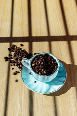 Coffee cup and beans on a background