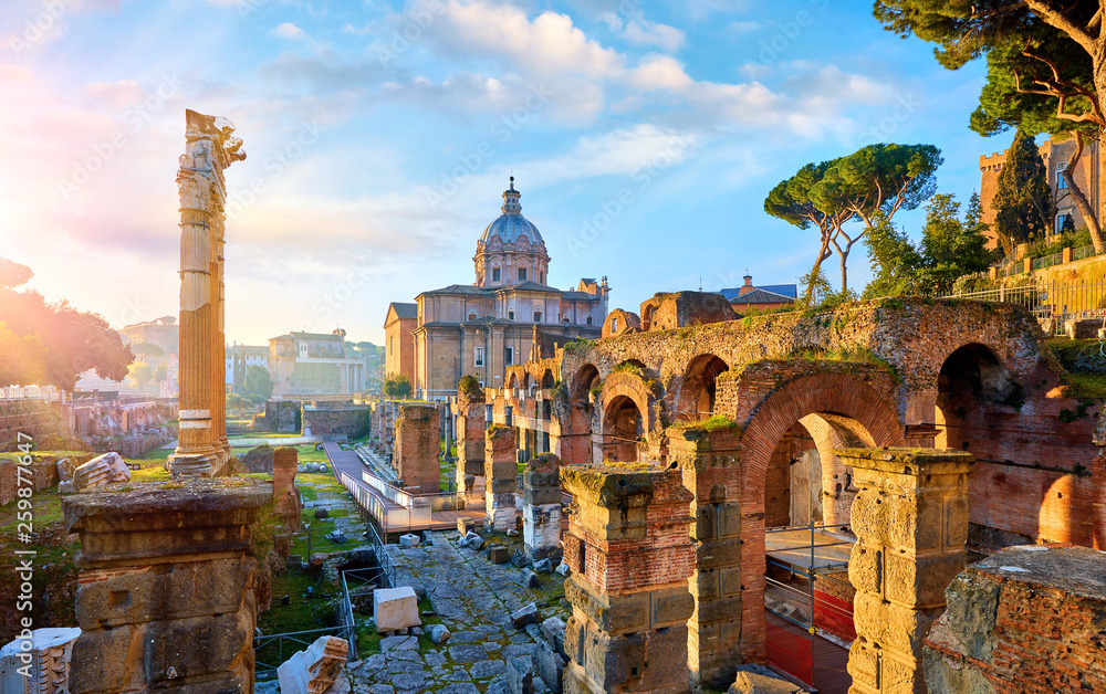 Roman Forum in Rome, Italy. Antique structures with columns and archs. Wrecks of ancient italian roman town. Church of Santi Luca e Martina. Sunrise above famous architectural landmark. - obrazy, fototapety, plakaty 