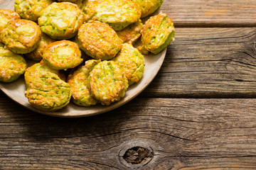 Canvas Print - homemade baked scone cakes from fresh ramson leaves and cheese, old wooden texture