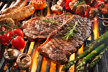 Delicious Grilled Meat With Vegetables Sizzling Over The Coals On Barbecue