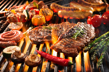 Poster - Delicious grilled meat with vegetables sizzling over the coals on barbecue