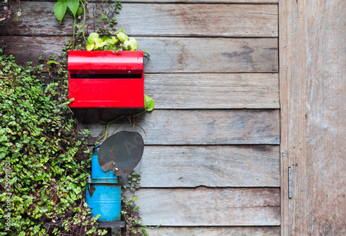 Red Mailbox On Wooden House Wall With Leaf Buy This Stock Photo