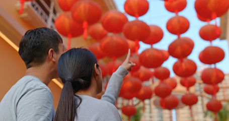 Poster - Couple look at the red lantern together