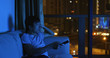 © leungchopan - Asian man watch tv at night