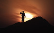 © Kirsty Pargeter - 3D silhouette of a soldier saluting against a sunset sky