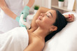 Young woman relaxing at the laser hair removal procedure