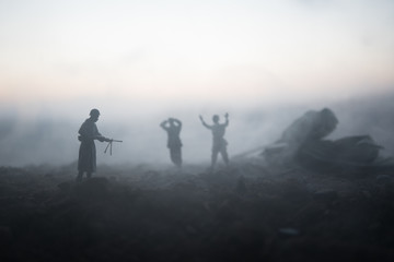 War Concept. Military silhouettes fighting scene on war fog sky background, World War Soldiers Silhouettes Below Cloudy Skyline At night. Attack scene. Armored vehicles. Tanks battle. Decoration