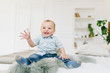 © Anastasiia - Cute little toddler boy waving his hand. Child waving hello or goodbye.