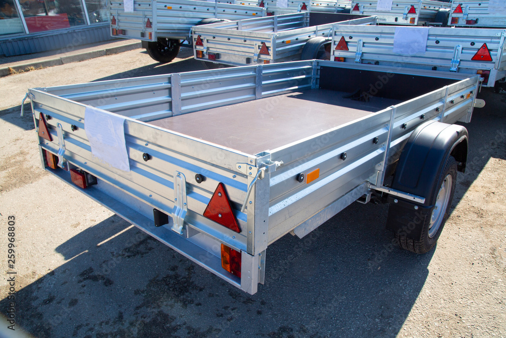 Open car trailer,ow; cargo; car trailer; trailer truck; tow bar.