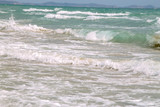 Fototapeta Morze - white soft wave on empty tropical beach and blue sea with blue sky