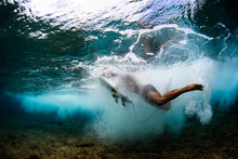 Underwater View Of The Surfer After Wipe Out In The Tropical Sea