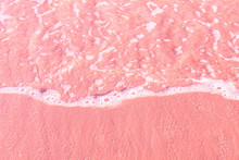 Foamy Clear Sea Wave Rolling To Pink Sand Shore Beach. Aerial View From Above. Beautiful Tranquil Idyllic Scenery. Tropical Nature Nautical Background. Beach Vacation Relaxation Paradise Wanderlust