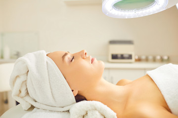 beautiful woman relaxes lying in the beauty salon.