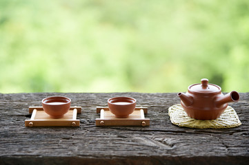 Chinese tea set oriental drink style on Natural green backdrop