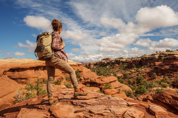 Poster - Hiker in Canyonlands National park, needles in the sky, in Utah, USA