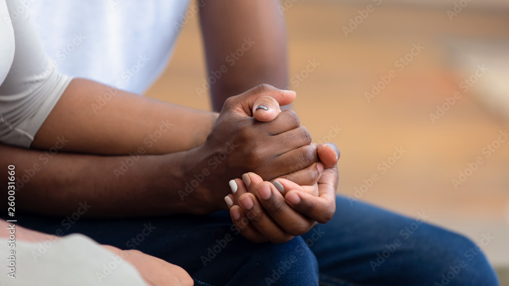African american family couple holding hands, close up view Stock Photo ...