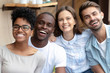 © fizkes - Happy multicultural friends group laughing looking at camera, portrait