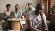 © fizkes - Upset lonely african american man suffering from bullying racial discrimination