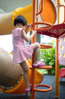 Leinwandbild Motiv Asian Chinese little girl climbing stepladder