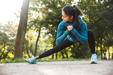 Poster - Beautiful young fitness woman doing morning exercising