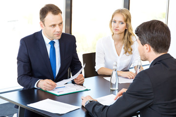 Business people discussing financial reports