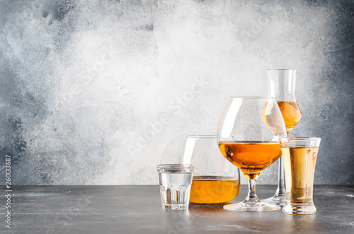 Cuadros en Lienzo Set of hard strong alcoholic drinks and spirits in glasses in assortment: vodka, cognac, tequila, brandy and whiskey, grappa, liqueur, vermouth, tincture, rum