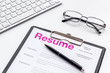 © 9dreamstudio - Review resumes of applicants set with keyboard and glasses white work desk background