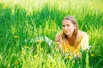 Smiling woman in summer park