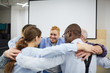 © Seventyfour - Group of people hugging all together during therapy session in support meeting, copy space