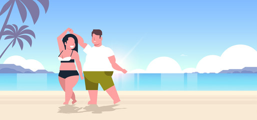 Wall Mural - fat obese couple wearing beach clothes overweight man woman dancing having fun summer vacation concept beautiful seaside sunset landscape background full length flat horizontal