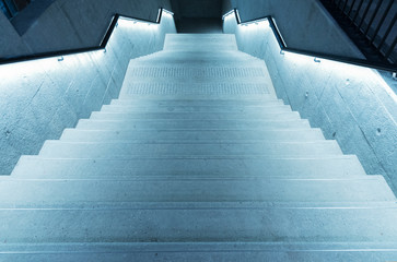 Wall Mural - illuminated empty old stairway in the dark