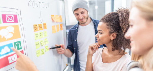 Designers drawing website ux app development.