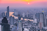 Fototapeta  - View of Bangkok skyline and skyscraper Panorama over Chao Phraya River Bangkok Thailand at sunset.