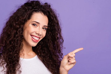 Wall Mural - Close up photo beautiful her she lady hold arm index finger empty space look what I have wave wealth hair lying shoulders wear casual white t-shirt clothes outfit isolated violet purple background