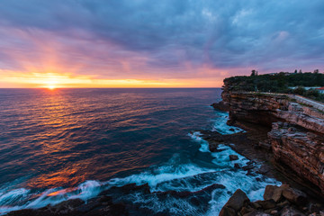 Canvas Print - wide view of sunrise at the gap rock cliff, watsons bay, sydney, australia.