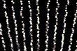 © sosiukin - Abstract glitter sparkle bokeh defocused on black background. many round light on background