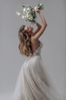 © irinaneva - beautiful sexy blonde bride posing in a sparkling wedding dress with bouquet. advertising space